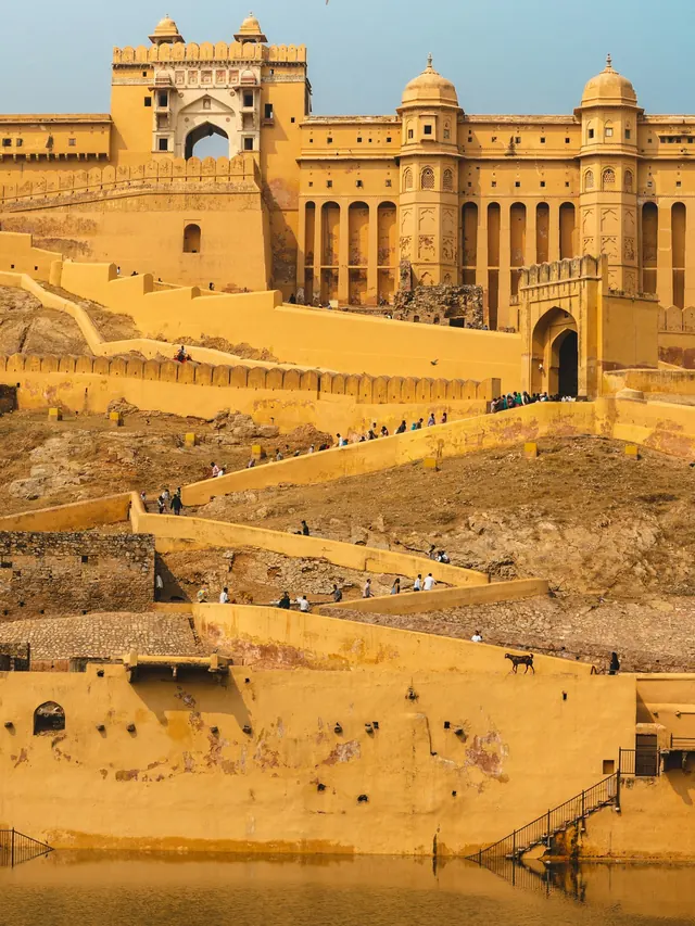 Amber Fort above the water at golden hour, Jaipur